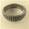 Image 1 : ONE STERLING SILVER NATURAL BLUE AND BLACK SAPPHIRE BANGLE STYLE BRACELET, SET WITH 205 OVAL MIXED