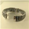 Image 2 : ONE STERLING SILVER NATURAL BLUE AND BLACK SAPPHIRE BANGLE STYLE BRACELET, SET WITH 205 OVAL MIXED