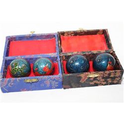 TWO SETS OF ORIENTAL MUSICAL BOADING BALLS