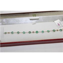 #15  14 KT GOLD EMERALD 4CT AND DIAMOND 0.15CT