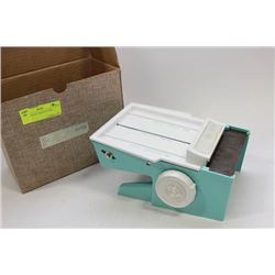 DIAL-O-MATIC FOOD CUTTER