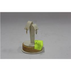 PAIR OF 10K YELLOW GOLD EARRINGS ON STAND