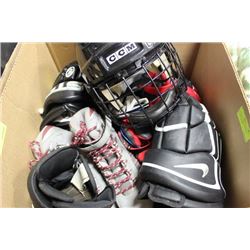 BOX WITH 3 PAIRS ICE SKATES, GLOVES, HELMET