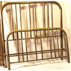 Antique brass bed with rails.