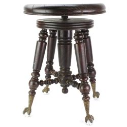 Antique piano stool on glass ball and claw