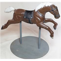 Vintage cast iron horse mounted on steel base