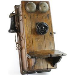 Antique oak wall phone.