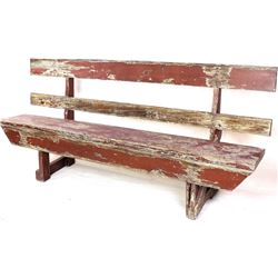 Old wood park bench with graped pealing