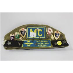 RUSSIAN COLD WAR ERA MILITARY HAT WITH 10 BADGES