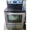 Image 1 : WHIRLPOOL STAINLESS STEEL AND BLACK GLASS TOP STOVE