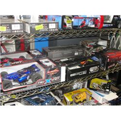 SHELF LOT OF ASSORTED RADIO CONTROLLED TOYS; HELICOPTERS, CARS, ETC