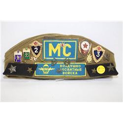 RUSSIAN COLD WAR ERA MILITARY HAT WITH 10 BADGES