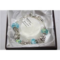 SILVER COLORED STONES & CHARMS BRACELET