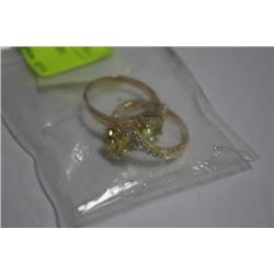 2 GOLD TONE FASHION RINGS IN BAG