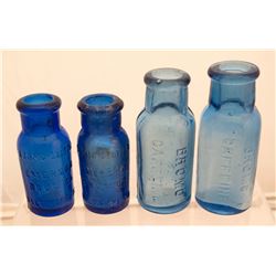 Nice group of four small bromo bottles