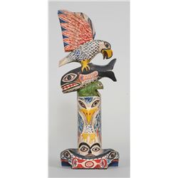 Henry Tait Totem Carved with Eagle, Whale, Frog and Raven on a Figural Base 1923  13 3/4" H. 5" W.  