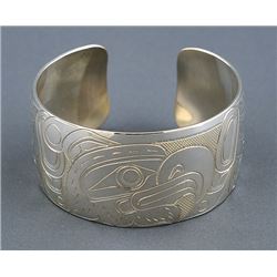 Northwest Coast Silver Bracelet with Incised Thunderbird Design by William Cook 6 1/4" L. 1 1/4" W.