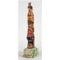 Coast Salish Totem Carved with Thunderbird, Bear Holding Human and Whale on a Frog Base by Alex Juli