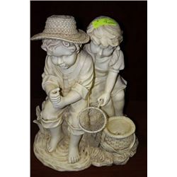 BOY AND GIRL GARDEN STATUE