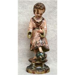 Early hand carved Santos figure of the Christ Child with left foot standing on the orb of the world