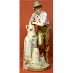 Large Royal Dux, Bohemia figurine of a young man at fountain. Non-professional glued restoration to 