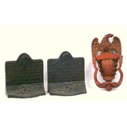 Two cast iron decorative items including 1) a Federal eagle door knocker signed Rostand on reverse, 