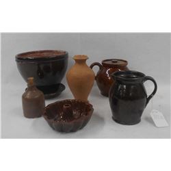 Six piece redware grouping including bean pot, turk mold, pitcher, planter, etc. Some with minor chi