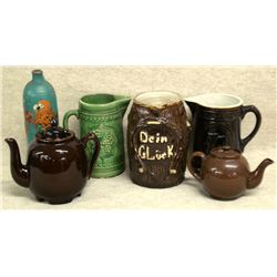 Six miscellaneous earthenware items including a large stoneware pitcher marked  Dein Gluck  (transla