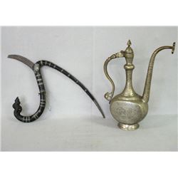 Two Middle Eastern decorative articles including a silver plated teapot etched with various figures;