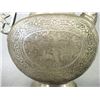 Image 6 : Two Middle Eastern decorative articles including a silver plated teapot etched with various figures;