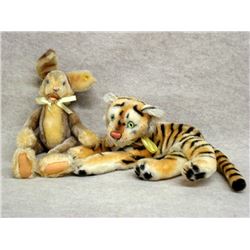 Two Steiff animals including a 17 H Rabbit with button in ear, and a 14 L Tiger, missing the button 