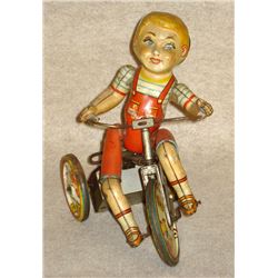 Kiddy Cyclist toy, Unique Art Mfg. NY & NJ, 1930's lithographed 8.5 -tall. The mechanism that powers