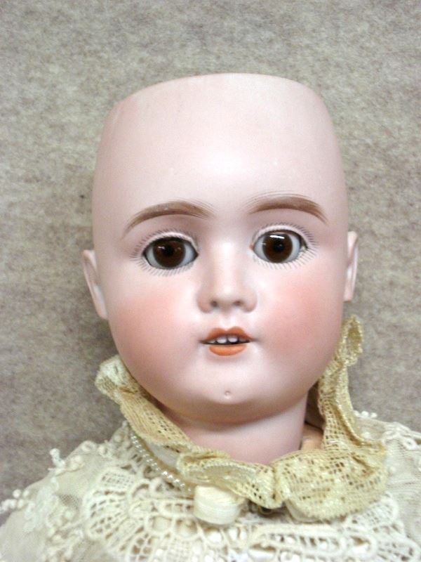German doll with bisque head, sleep brown eyes marked made in Germany