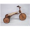 Image 2 : Early 20th C. tricycle with a wooden seat and hard rubber wheels, remnants of old red paint and whit
