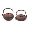 Image 1 : Lot of two Japanese cast iron tea pots (Tetsubin) including 1) a hobnail with an acorn finial on the