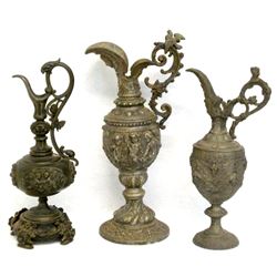 Three ewers including: 1) made of bronze with an eagle like head at the top of the handle and two ch