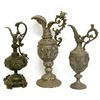 Image 1 : Three ewers including: 1) made of bronze with an eagle like head at the top of the handle and two ch