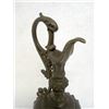Image 6 : Three ewers including: 1) made of bronze with an eagle like head at the top of the handle and two ch