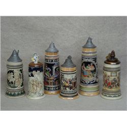 Six German beer steins including a one liter stein with a beer hall scene where it appears three ove