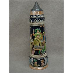 Massive German beer stein 26.5 H, main figure is of three men at a table with a maiden leaning on th