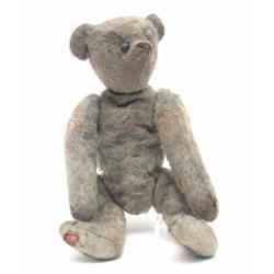 A small mohair Teddy Bear, possibly Bing, circa 1910, with boot button eyes and jointed limbs (pl...