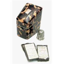 A Victorian tortoiseshell wedge shaped needle box, with ivory lined compartmented interior and a...