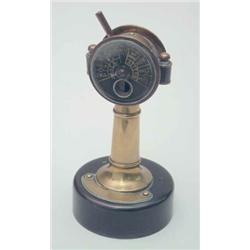 A novelty brass cigar cutter, in the form of a ships telegraph, c.1910, 5.5ins high...