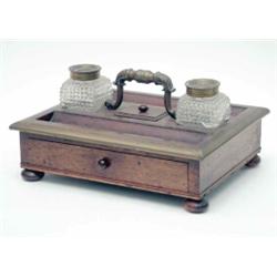 An early Victorian rosewood and brass mounted desk stand with two cut glass inkwells, a covered r...