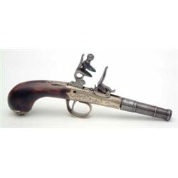 An early 18th century design reproduction pocket pistol with engraved brass mounts....