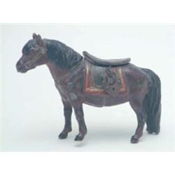 A painted spelter "horse" coin- box, with a hinged saddle, (one foot broken) 3.25ins...