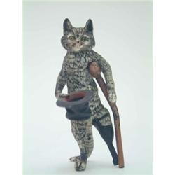 An Austrian early 20th century cold-painted bronze novelty cat, with a wooden leg standing offeri...