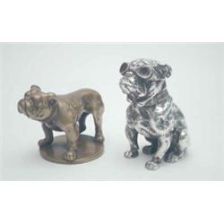 A silvered bronze novelty bulldog car mascot, with goggles which glow red when running, stamped "...