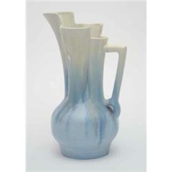 A Beswick ewer of stylised form, with geometric handle and 3 section rim, decorated in mottled ye...