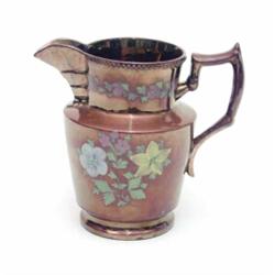 A gold lustre jug, painted with flowers, 8ins...